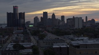 5.7K aerial stock footage of flying by the city's tall skyscrapers at sunset, Downtown Detroit, Michigan Aerial Stock Footage | DX0002_197_048