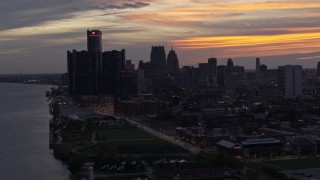 5.7K aerial stock footage the city's towering skyscrapers at sunset seen from the Detroit River, Downtown Detroit, Michigan Aerial Stock Footage | DX0002_198_007