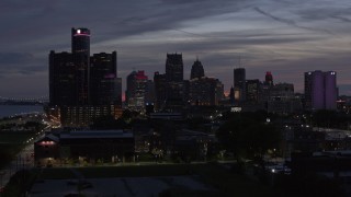 5.7K aerial stock footage ascend and approach tall skyscrapers at twilight in Downtown Detroit, Michigan Aerial Stock Footage | DX0002_198_018