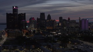 5.7K aerial stock footage flying by giant skyscrapers at twilight in Downtown Detroit, Michigan Aerial Stock Footage | DX0002_198_019