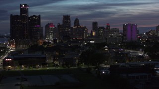 5.7K aerial stock footage of ascending toward the city's skyline at twilight in Downtown Detroit, Michigan Aerial Stock Footage | DX0002_198_025