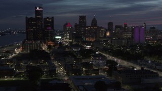 5.7K aerial stock footage of the city's skyline, seen from Jefferson Ave, at twilight in Downtown Detroit, Michigan Aerial Stock Footage | DX0002_198_028