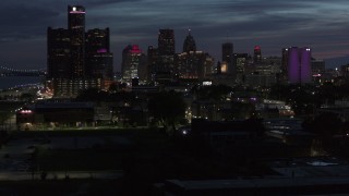 5.7K aerial stock footage of the city's skyline, seen during descent at twilight in Downtown Detroit, Michigan Aerial Stock Footage | DX0002_198_031