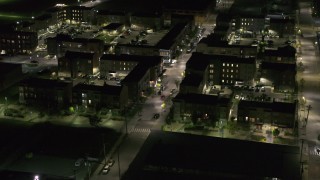 5.7K aerial stock footage approach and orbit Franklin Street and an apartment complex at night, Downtown Detroit, Michigan Aerial Stock Footage | DX0002_198_052