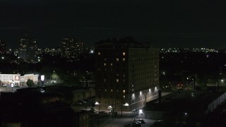 5.7K aerial stock footage of orbiting an apartment building at night, Detroit, Michigan Aerial Stock Footage | DX0002_198_058