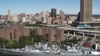 5.7K aerial stock footage flyby apartment buildings, skyline, and USS Little Rock, Downtown Buffalo, New York Aerial Stock Footage | DX0002_200_009