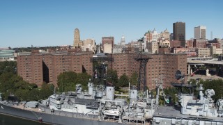 5.7K aerial stock footage of the skyline while descending past apartment buildings, Downtown Buffalo, New York Aerial Stock Footage | DX0002_200_014