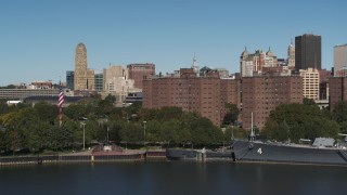 DX0002_201_007 - 5.7K aerial stock footage descend by river near Marine Drive Apartments, Downtown Buffalo, New York