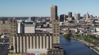 5.7K aerial stock footage ascend and orbit a grain elevator in Buffalo, New York Aerial Stock Footage | DX0002_201_021