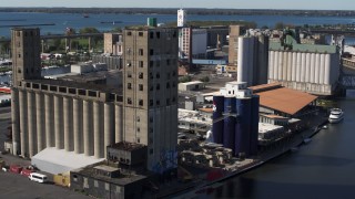 5.7K aerial stock footage of an orbit around a large grain elevator in Buffalo, New York Aerial Stock Footage | DX0002_201_025