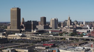 5.7K aerial stock footage of flying by the city's skyline behind Sahlen Field baseball stadium, Downtown Buffalo, New York Aerial Stock Footage | DX0002_201_028