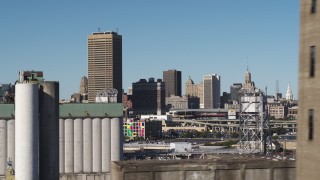 DX0002_201_034 - 5.7K aerial stock footage pass grain elevators for view of the city's skyline and baseball stadium, Downtown Buffalo, New York