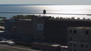 5.7K aerial stock footage of orbiting a water tower on a flour mill in Buffalo, New York Aerial Stock Footage | DX0002_201_037