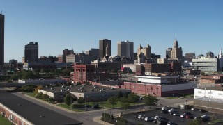 DX0002_202_012 - 5.7K aerial stock footage of Erie Community College and office towers in Downtown Buffalo, New York