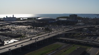 DX0002_202_023 - 5.7K aerial stock footage of an orbit of KeyBank Center arena and freeway, Downtown Buffalo, New York