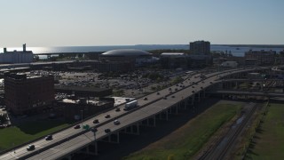 DX0002_202_024 - 5.7K aerial stock footage focus on KeyBank Center arena and descend by freeway, Downtown Buffalo, New York