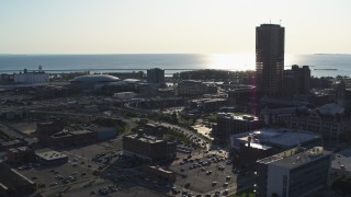 5.7K aerial stock footage descend past arena and baseball stadium by skyscraper in Downtown Buffalo, New York Aerial Stock Footage | DX0002_203_010