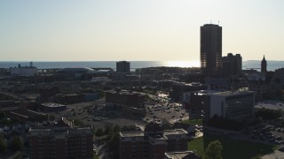 5.7K aerial stock footage of ascending away from a skyscraper and city buildings in Downtown Buffalo, New York Aerial Stock Footage | DX0002_203_012