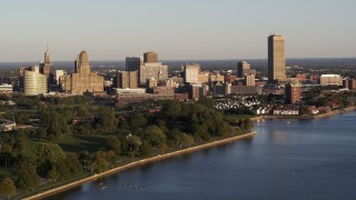 5.7K aerial stock footage of the city's skyline at sunset, seen from the lakeside park, Downtown Buffalo, New York Aerial Stock Footage | DX0002_203_032