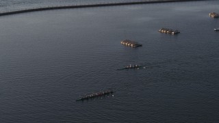 5.7K aerial stock footage tracking two rowboats on Lake Erie at sunset, Buffalo, New York Aerial Stock Footage | DX0002_203_043