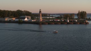 5.7K aerial stock footage approach Lake Erie lighthouse at sunset, Buffalo, New York Aerial Stock Footage | DX0002_204_017