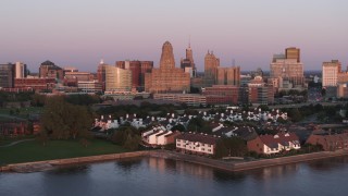 5.7K aerial stock footage a view of city hall and office buildings at sunset, seen from waterfront condos, Downtown Buffalo, New York Aerial Stock Footage | DX0002_204_025