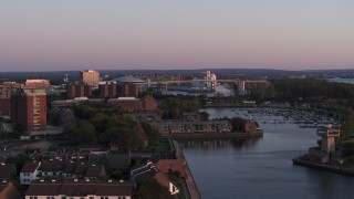 5.7K aerial stock footage of a wide view of the Buffalo Skyway behind marina at sunset, Downtown Buffalo, New York Aerial Stock Footage | DX0002_204_027