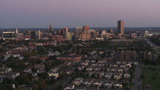 5.7K aerial stock footage of a wide view of the city's skyline at twilight, Downtown Buffalo, New York Aerial Stock Footage | DX0002_204_028