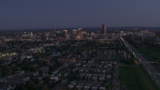 5.7K aerial stock footage of the skyline while ascending over neighborhoods at twilight, Downtown Buffalo, New York Aerial Stock Footage | DX0002_204_045