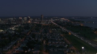 5.7K aerial stock footage wide view of Seneca One Tower and skyline at twilight, Downtown Buffalo, New York Aerial Stock Footage | DX0002_204_054