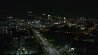 5.7K aerial stock footage of a reverse view of the skyline at night, Downtown Buffalo, New York Aerial Stock Footage | DX0002_205_008