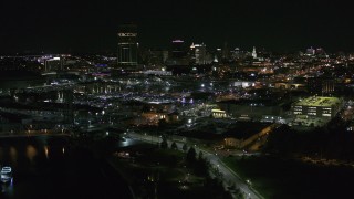 5.7K aerial stock footage of the skyline while descending by river at night, Downtown Buffalo, New York Aerial Stock Footage | DX0002_205_012