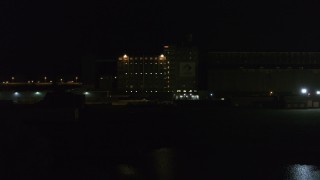 5.7K aerial stock footage slowly approach and orbit flour mill at night, Buffalo, New York Aerial Stock Footage | DX0002_205_019