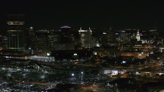 5.7K aerial stock footage of passing by a skyscraper and office towers at night, Downtown Buffalo, New York Aerial Stock Footage | DX0002_205_028