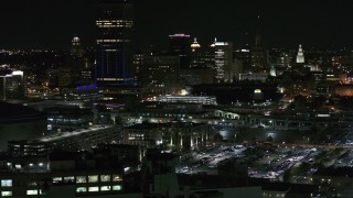 5.7K aerial stock footage of the skyline seen while passing parking lots at night, Downtown Buffalo, New York Aerial Stock Footage | DX0002_205_033