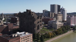 DX0002_206_025 - 5.7K aerial stock footage orbit riverfront apartment complex overlooking the river, Downtown Rochester, New York