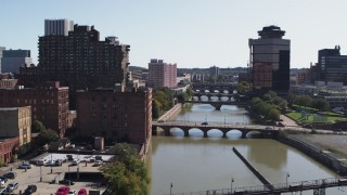 5.7K aerial stock footage fly away from First Federal Plaza and bridges to reveal High Falls, Downtown Rochester, New York Aerial Stock Footage | DX0002_206_036