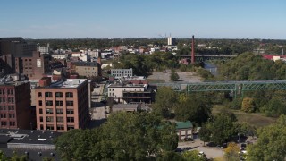 5.7K aerial stock footage smoke stack and bridges spanning the river, Rochester, New York Aerial Stock Footage | DX0002_206_046