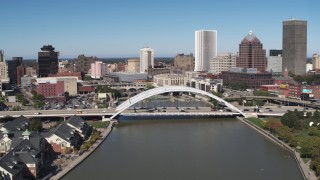 5.7K aerial stock footage slowing approach bridge over Genesee River near skyline, Downtown Rochester, New York Aerial Stock Footage | DX0002_207_012