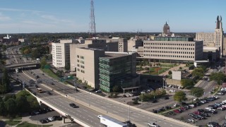 DX0002_207_014 - 5.7K aerial stock footage of the police station during descent, Downtown Rochester, New York