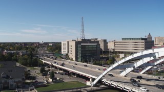 5.7K aerial stock footage of a reverse view and orbit of the police station, Downtown Rochester, New York Aerial Stock Footage | DX0002_207_015