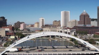 5.7K aerial stock footage focus on high-rises while passing Douglass-Anthony Bridge, Downtown Rochester, New York Aerial Stock Footage | DX0002_207_029