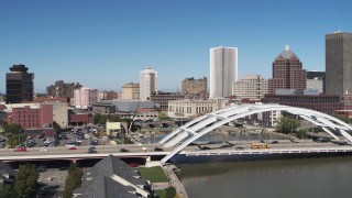 5.7K aerial stock footage focus on skyline while flying away from Douglass-Anthony Bridge, Downtown Rochester, New York Aerial Stock Footage | DX0002_207_030