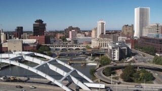 5.7K aerial stock footage flyby and descend near the Douglass-Anthony Bridge with view of river and Downtown Rochester, New York Aerial Stock Footage | DX0002_207_037