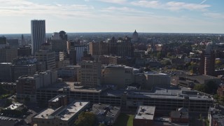 5.7K aerial stock footage descend and flyby office buildings and parking garage, Downtown Rochester, New York Aerial Stock Footage | DX0002_208_015