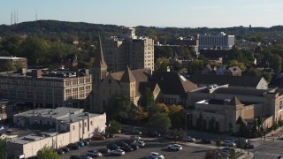 5.7K aerial stock footage ascend while focused on a church in Rochester, New York Aerial Stock Footage | DX0002_208_025