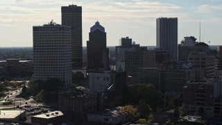 DX0002_208_033 - 5.7K aerial stock footage of descending past skyscrapers and office towers in Downtown Rochester, New York