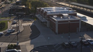 5.7K aerial stock footage of circling a brick train station at sunset in Downtown Rochester, New York Aerial Stock Footage | DX0002_209_025