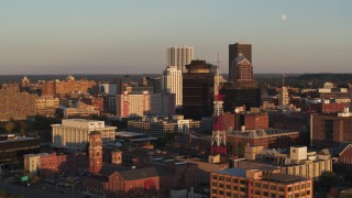 DX0002_209_032 - 5.7K aerial stock footage orbit First Federal Plaza, office buildings, and a radio tower at sunset, Downtown Rochester, New York