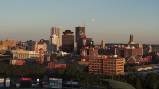 5.7K aerial stock footage orbit a radio tower near First Federal Plaza at sunset, Downtown Rochester, New York Aerial Stock Footage | DX0002_209_033